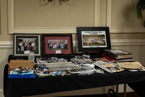 A picture containing text, table, cluttered, dining table

Description automatically generated