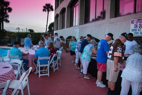 A group of people standing outside a building

Description automatically generated with low confidence