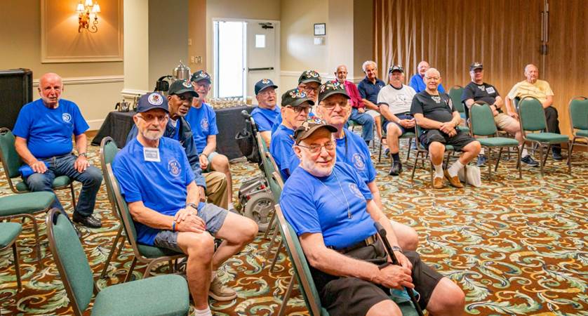 A group of people sitting in chairs

Description automatically generated with medium confidence