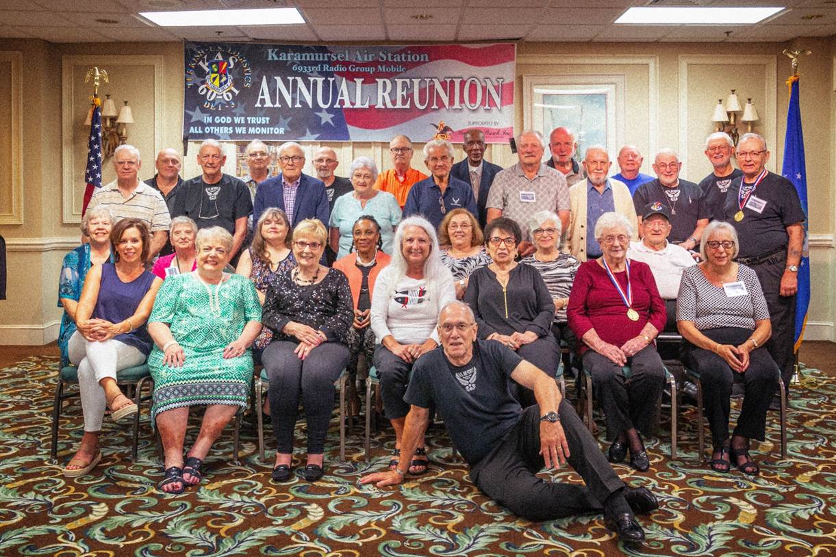 A group of people posing for a photo

Description automatically generated