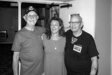 A group of people posing for the camera

Description automatically generated