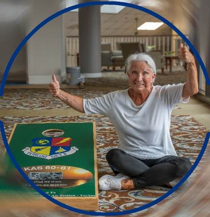 A person sitting on the floor with her thumbs up

AI-generated content may be incorrect.